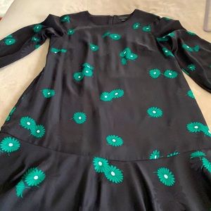 Very cute silky black Ann Taylor dress with flouncy hem.